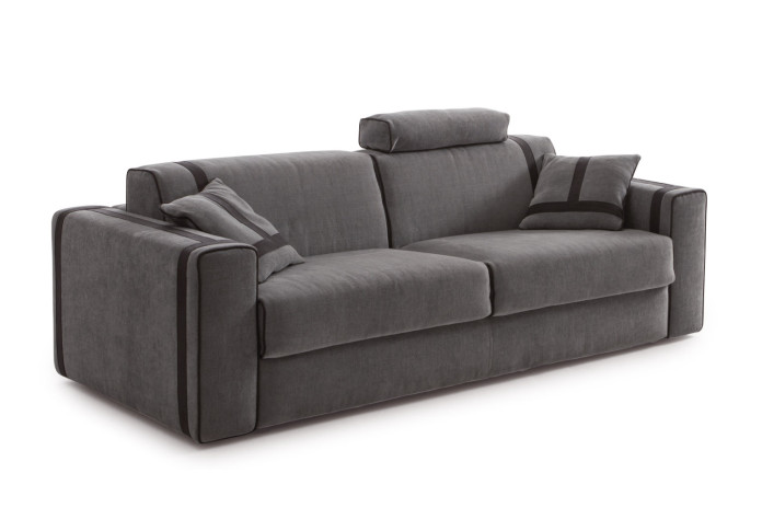 The sofa bed can be completed with an headrest cushion, decorative cushions and an ottoman