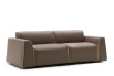 Parker is a design sofa with low backrest, wide seat cushions, and flared armrests.