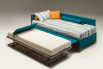 The extra bed can be adjusted to the same height of the main one by lifting the panel connected to the mechanism
