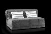 Gil folding sleeper sofa with decorative cushions.